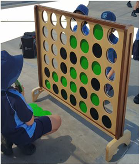 Students playing giant connect 4